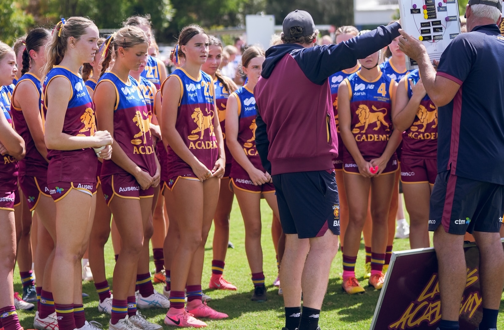 Brisbane Lions Academy players receive instruction from coaches